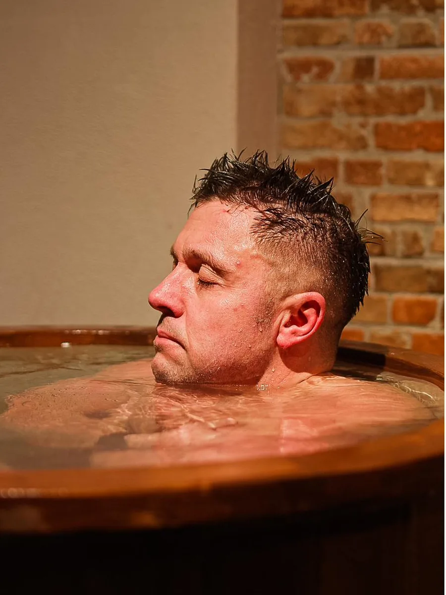 A member taking the plunge — cold-water immersion at Pulse Club